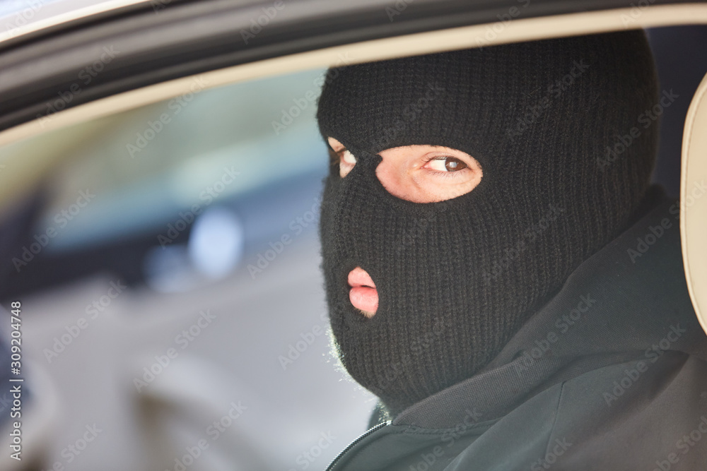 Man with balaclava as a criminal or terrorist Man with balaclava as a criminal or terrorist