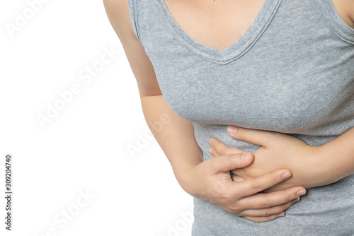 Asian woman having suffer stomachache. Gastritis and Abdominal bloating concept. © Sakoodter Stocker
