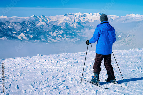 Man Skier skiing in Zillertal Arena ski resort Austria