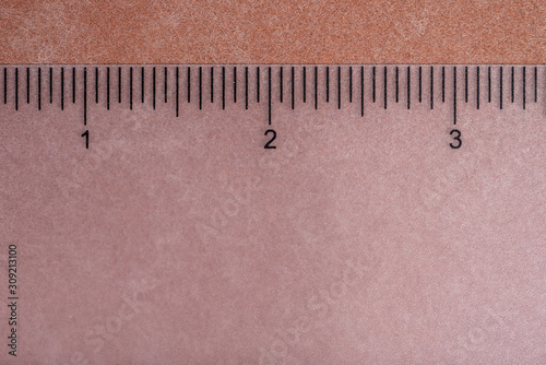 transparent ruler on neutral background with sharp lines showing numbers 1 2 3 photo