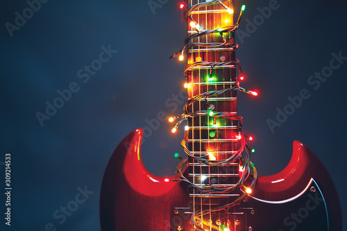 electric guitar with festive Christmas lights