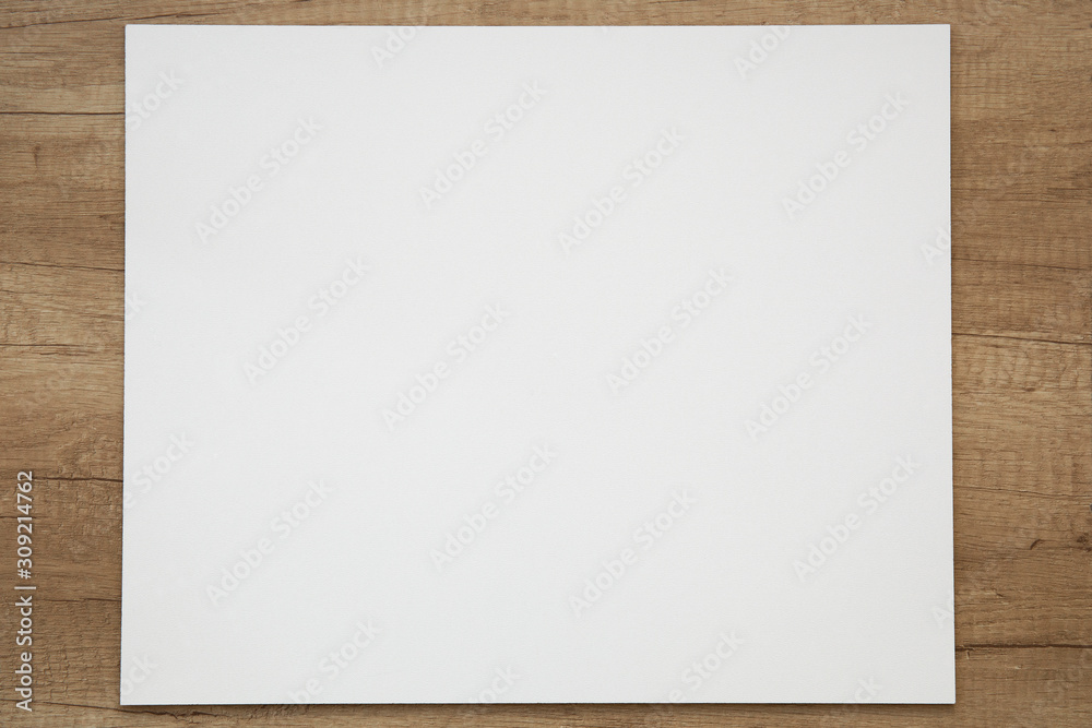 White mock up on a light wooden background. White mock up on a light wooden background.