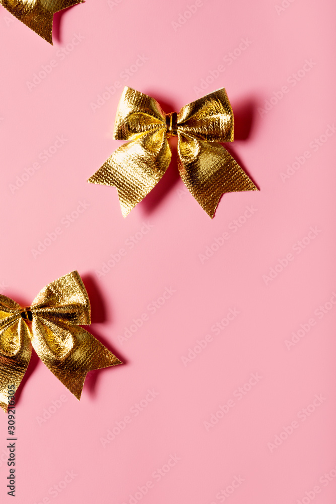 Pink celebration background with golden bow Pink celebration background with golden bow