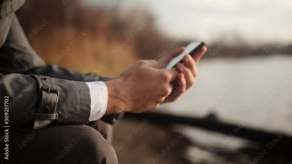 Mobile Phone In Hand.Holding Smartphone Using Social Networks.Texting And Looking At Cell Phone Using App And Browsing In Internet.Businessman Holding Mobile Phone. Mobile Phone In Hand.Holding Smartphone Using Social Networks.Texting And Looking At Cell Phone Using App And Browsing In Internet.Businessman Holding Mobile Phone.