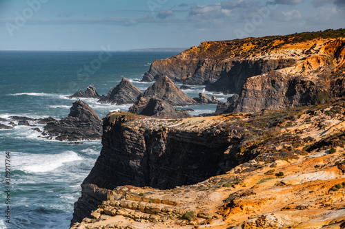 Rocky coastline in the Costa Vicentina natural park at the Atlantic Ocean at the Algarve, Portugal.