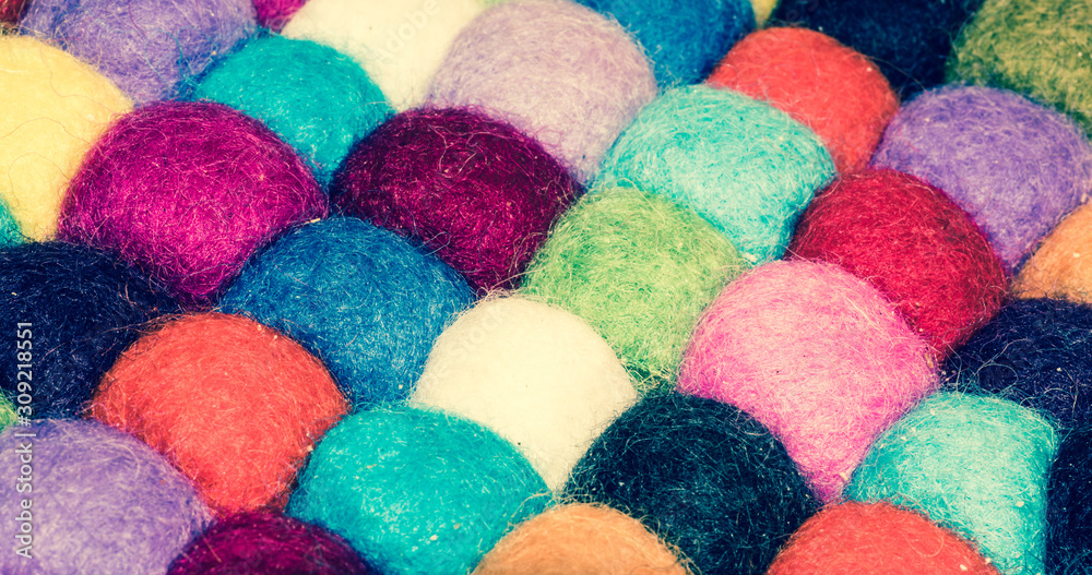 A lot of multi-colored balls of cotton for knitting close-up. Colored skeins of thread for needlework. Selective focus image. A lot of multi-colored balls of cotton for knitting close-up. Colored skeins of thread for needlework. Selective focus image.