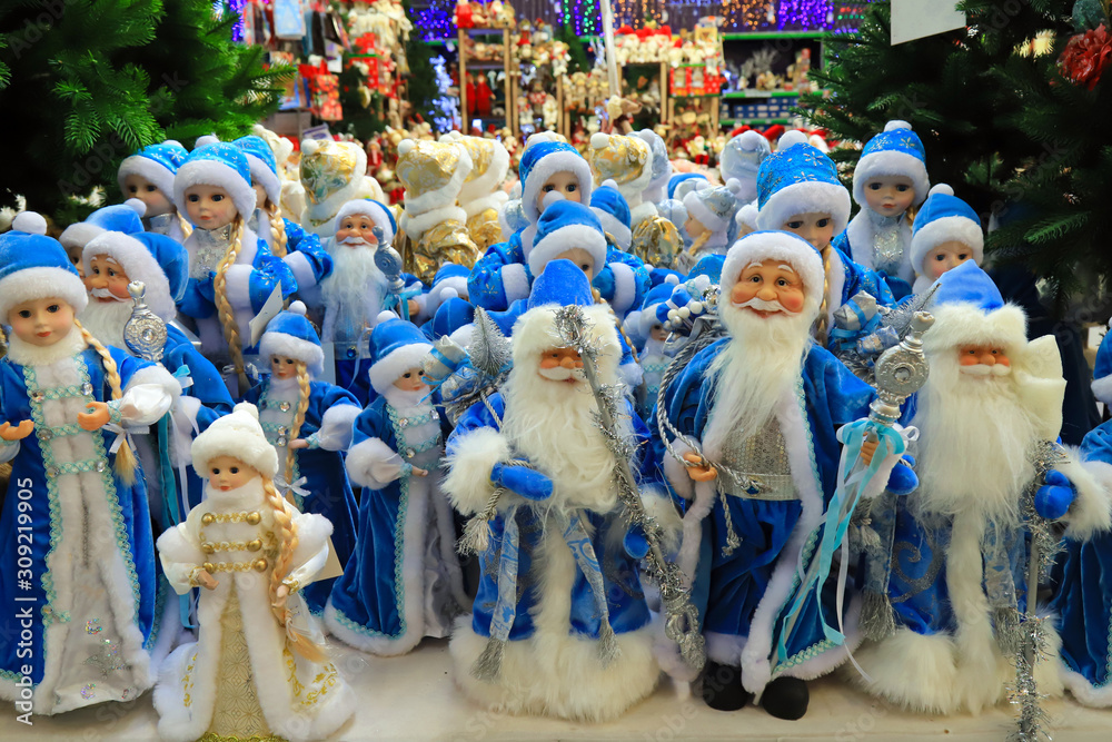 Funny beautiful blue Santa Claus, Snow Maiden, favorite New Year and Christmas toys, decorations and gifts, the best positive emotions. Festive Christmas winter trade, shopping. Toy Store Fair