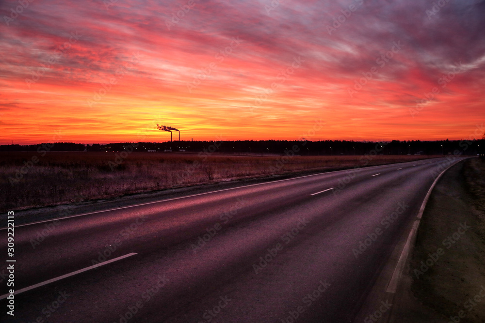 road going to horizon at dawn
