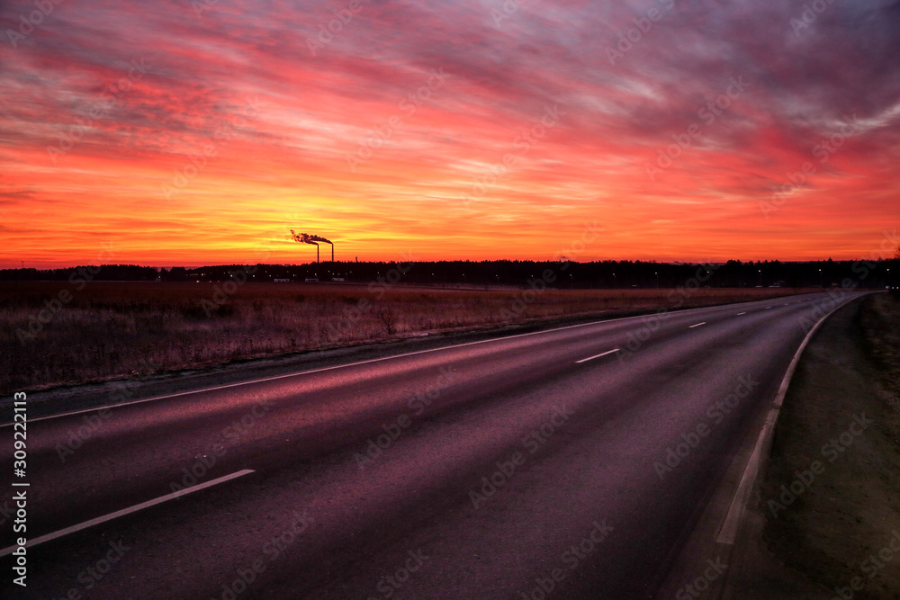 Fototapeta premium road going to horizon at dawn