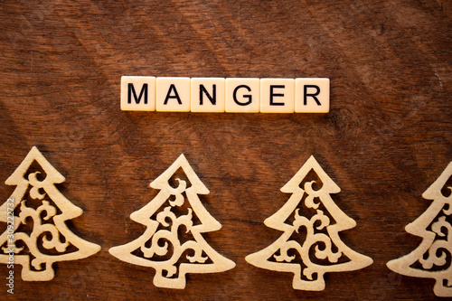 the word Manger on wood