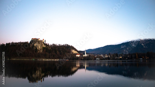 Sunrise view of lake Bled in winter with the castle and town
