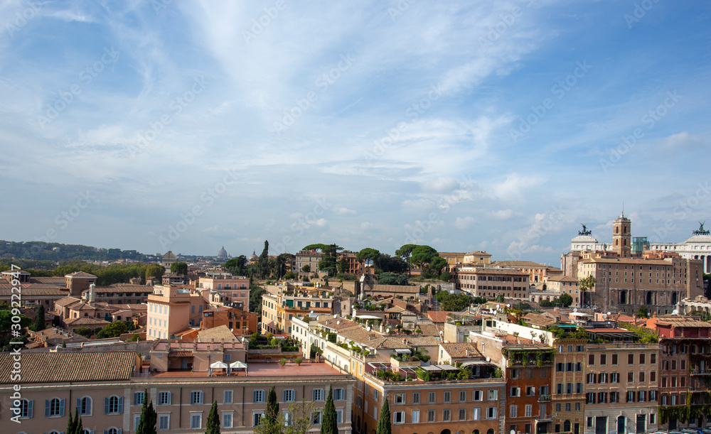 Panoramic view of the roofs in Rome and St Peter's Cathedral in the background