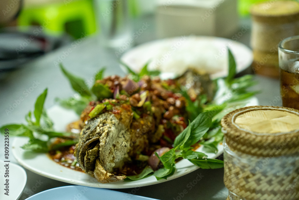 Herbal snakehead fish salad served with sticky rice Herbal snakehead fish salad served with sticky rice