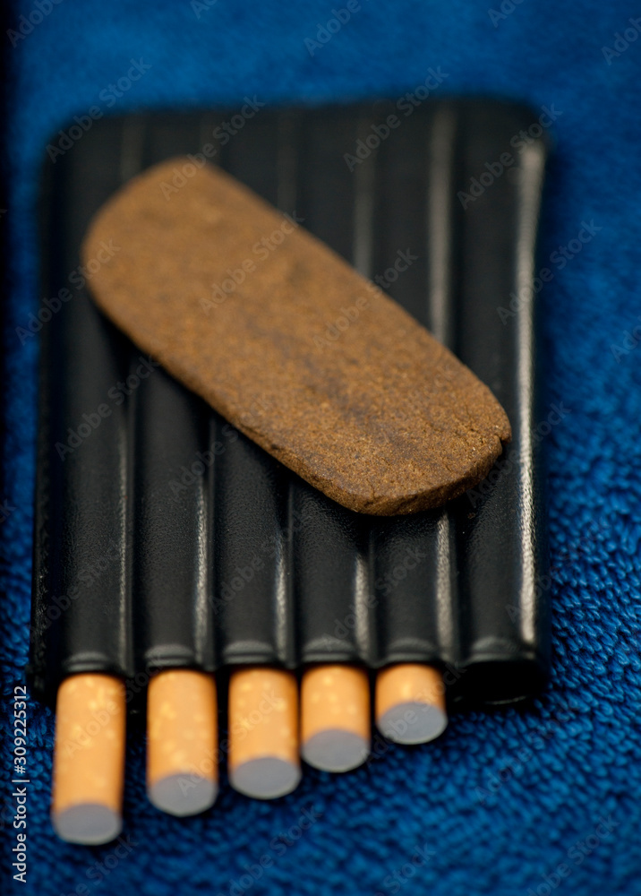 Medical Hashis in the Kingdom of Morocco CBD medical Moroccan cannabis hashish piece on top of