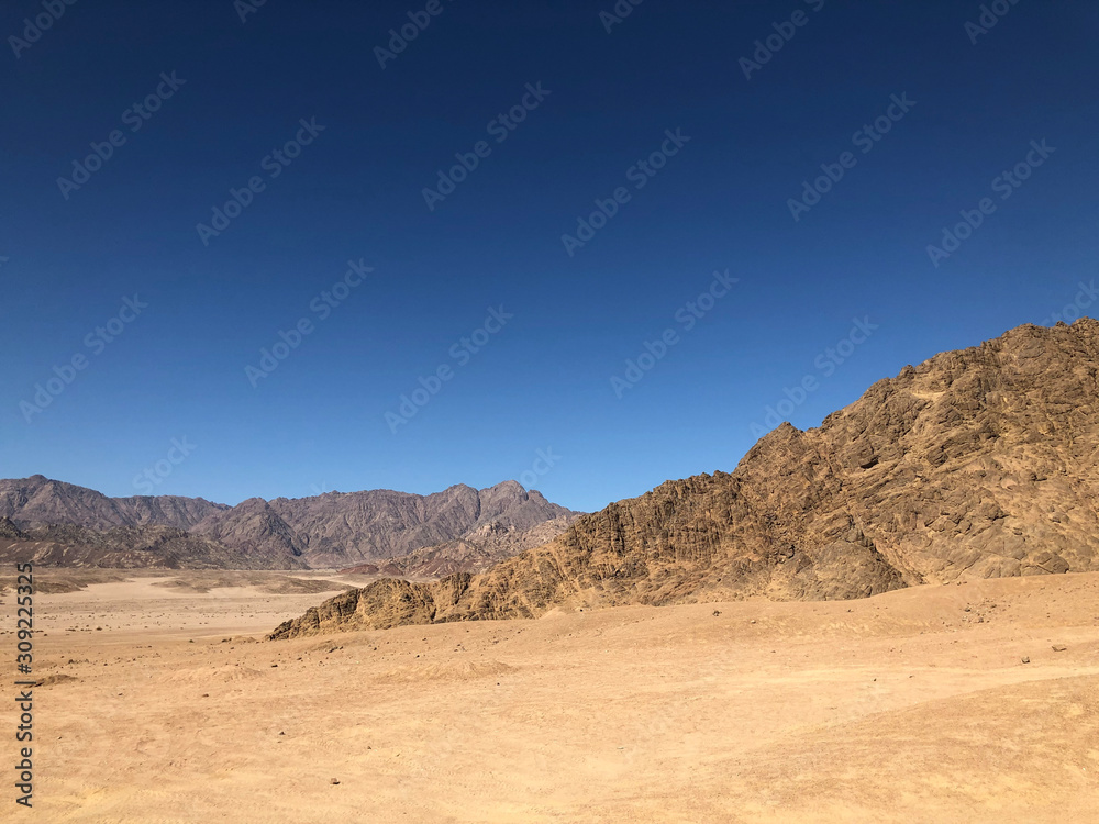 Landscape Sandy mountains, blue sky in the desert of Egypt.