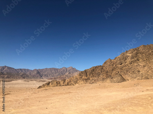 Landscape Sandy mountains, blue sky in the desert of Egypt.