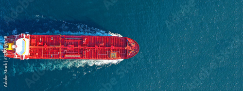 Aerial drone ultra wide panoramic photo of industrial fuel and petrochemical tanker cruising open ocean deep blue sea