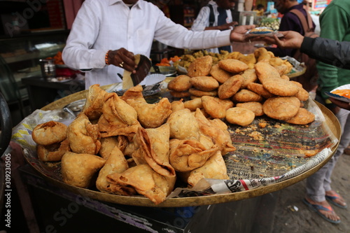 Street food in Jaipur, India. Traditional indian food - samosa and other.
