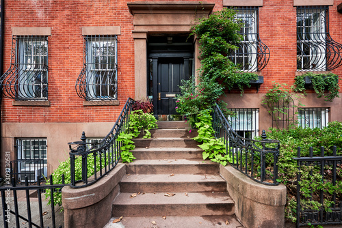 Photography Steps leading up to a historic brownstone building in an iconic neighborhood of Manhattan, New York City