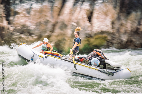People on a raft in Specter Rapid, Colorado River, Grand Canyon National Park, Arizona, USA
