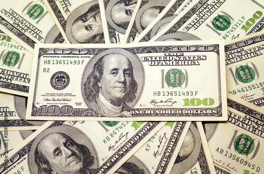 One hundred dollar banknotes background.