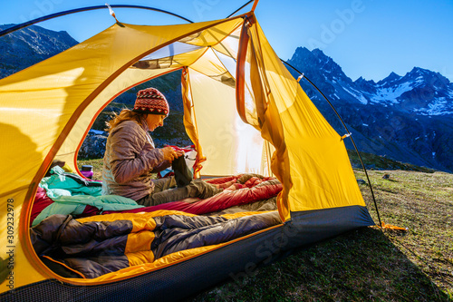 Woman camping in Talkeetna Mountains