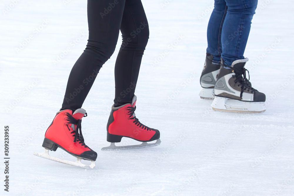 people ice skating on an ice rink. Hobbies and sports. Vacations and winter activities. people ice skating on an ice rink. Hobbies and sports. Vacations and winter activities.