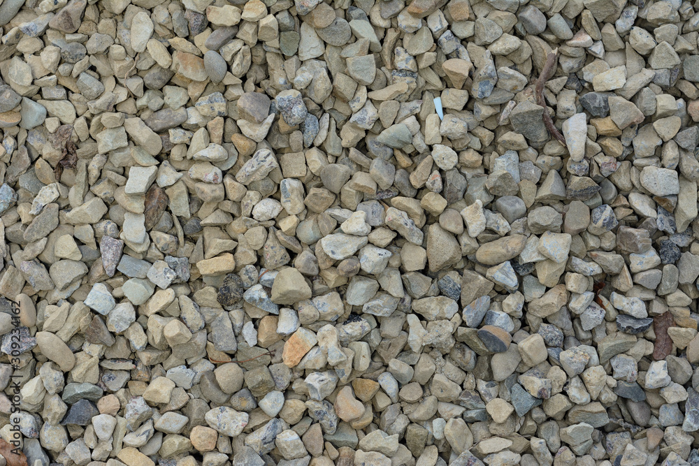 Closeup texture of small and small gray and white stones. Closeup texture of small and small gray and white stones.