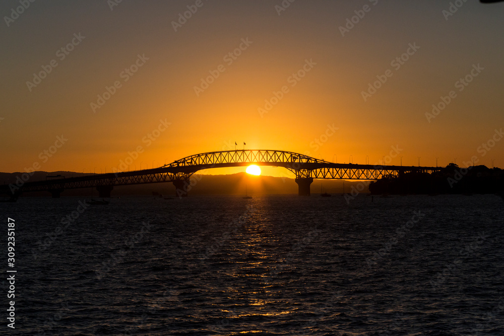 Auckland Harbour Bridge at sunset.