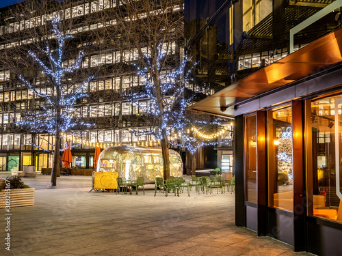 Night scene of Broadgate square illuminated in Christmas lights in the city of London, near Liverpool street in  England, UK photo