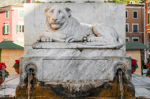 Marble lion on the monument to Maria Beatrice d'Este in Alberica square photo