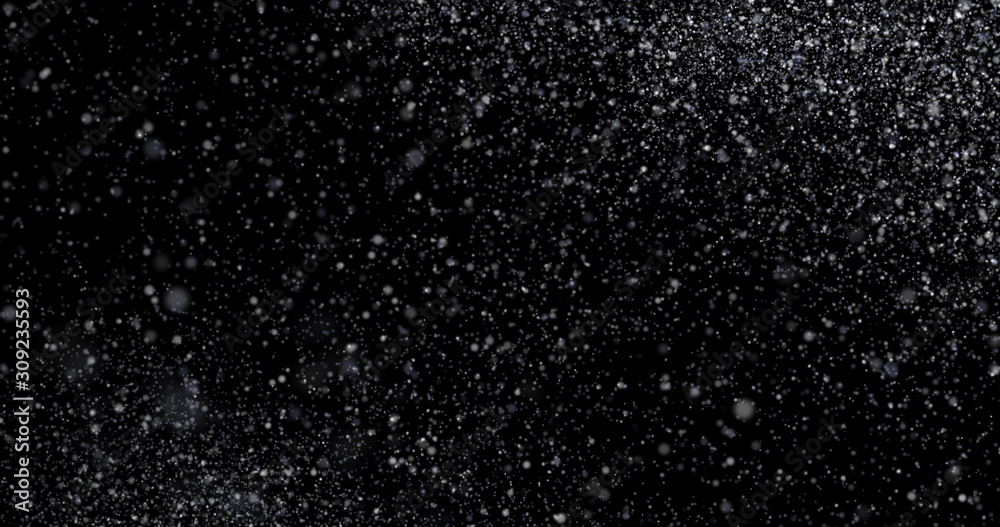 Natural white winter snowfall on a black background