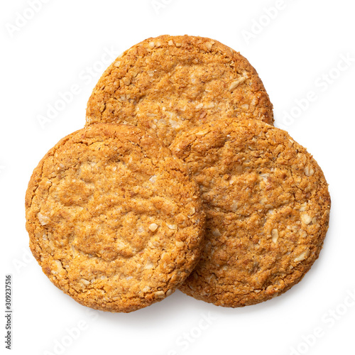 Three crunchy oat and wholemeal biscuits isolated on white. Top view. photo