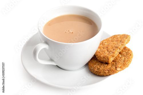 Bilde på lerret Cup of tea with milk and one and half crunchy oat and wholemeal biscuits isolated on white