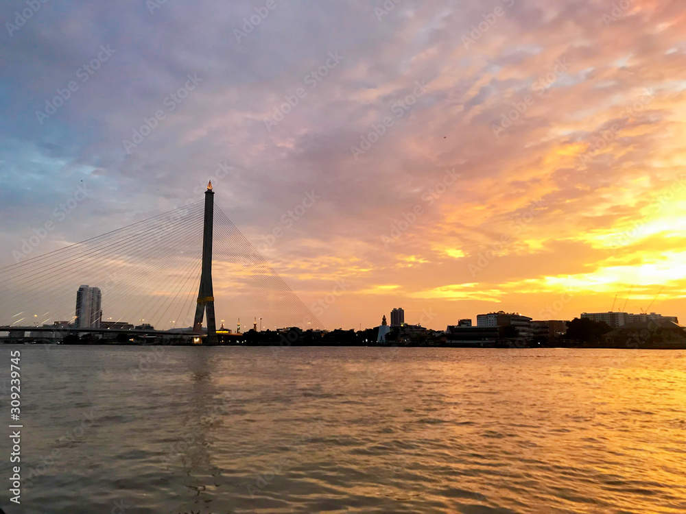 Sunset view at Chao Phaya river with water light reflection Bangkok. Thailand, selective focus