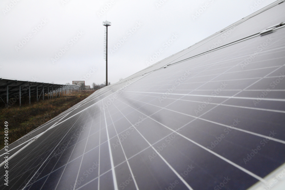 Sunlight gleams off solar panel. Solar panel produces green, environmentally friendly energy from the sun. Sunlight gleams off solar panel. Solar panel produces green, environmentally friendly energy from the sun.