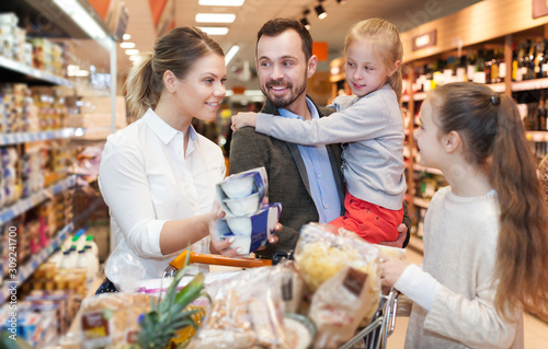 family is choosing food for dinner