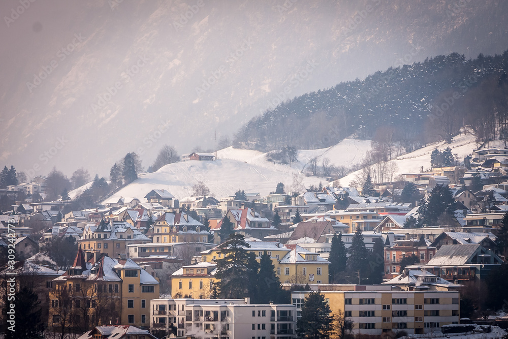 Innsbruck in winter, Austria. Beautiful aerial panoramic view, mountains covered with snow in the background