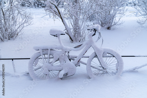 After a very heavy snowfall in the courtyard of Kronstadt remained snow-covered bike.