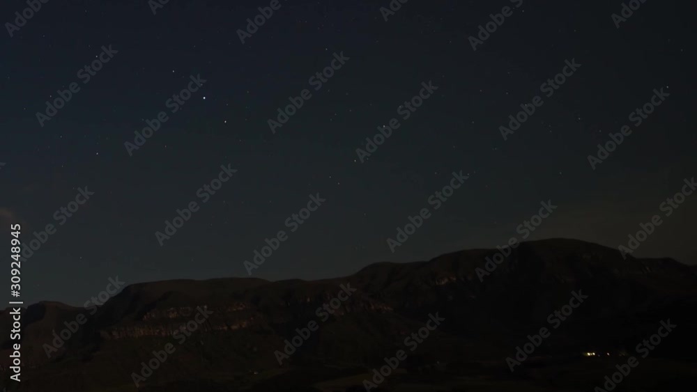 Moon light Time lapse of clouds streaming over the Drakensberg Mountains in South Africa, Panning left and up, Zooming out Moon light Time lapse of clouds streaming over the Drakensberg Mountains in South Africa, Panning left and up, Zooming out