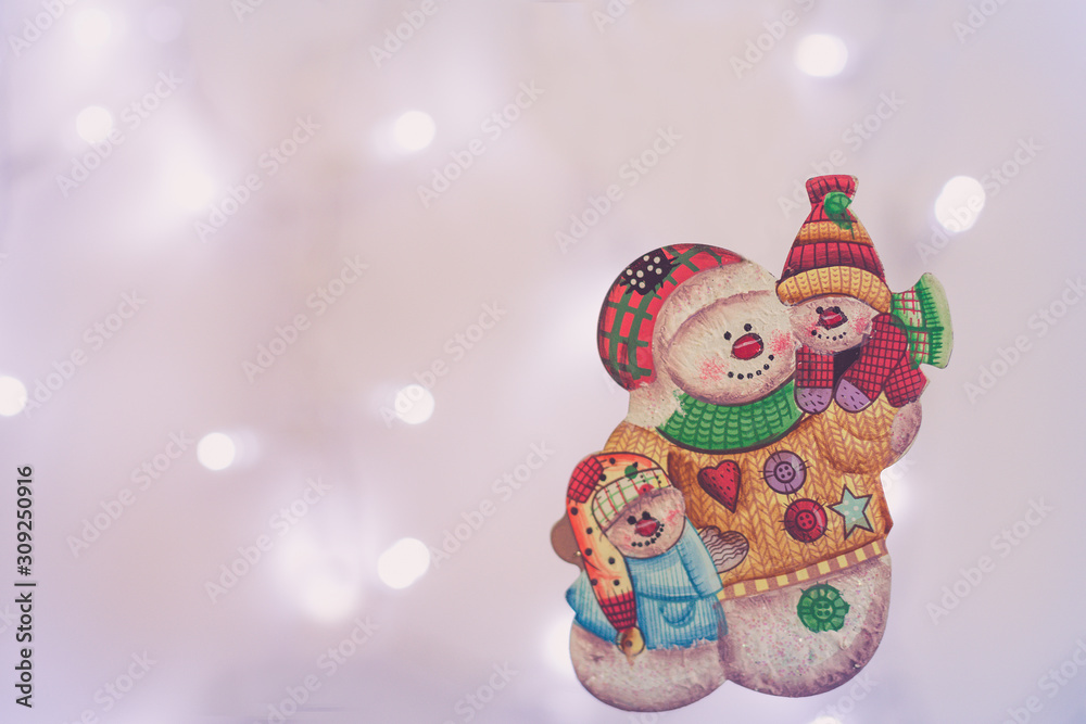 snow man  Christmas decoration in a shiny background