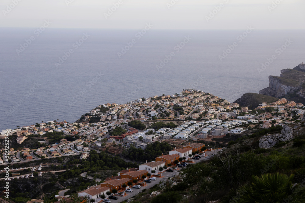 Areal view at the Spanish coastline. Luxury villas on the coast. Summer vacation mood. Popular holiday destination.