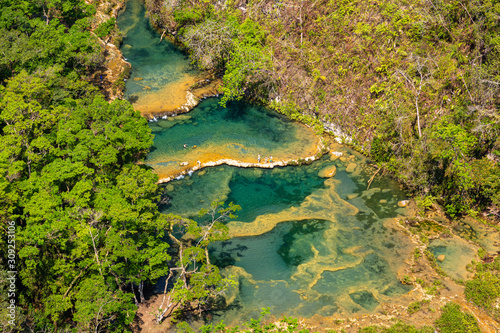 Panorama of the limestone ridge with cascades and waterfalls of Semuc Champey in the Peten jungle and rainforest of Guatemala.