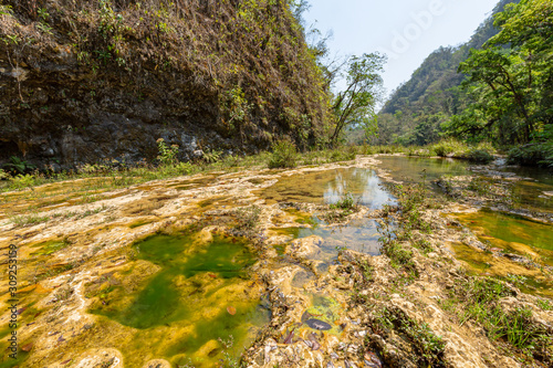 Limestone ridge with cascades and waterfalls of Semuc Champey in the Peten jungle and rainforest of Guatemala.