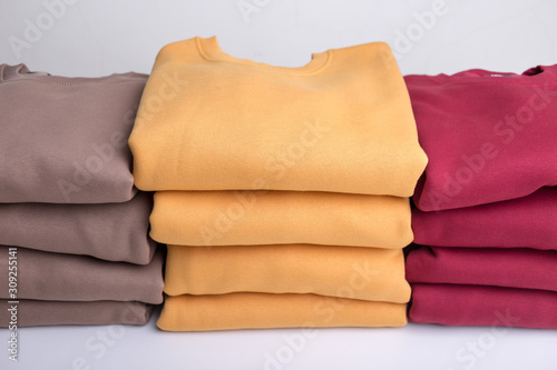 Stack of blank colorful sweatshirts closeup