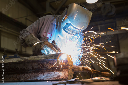 Man welding with sparks flying