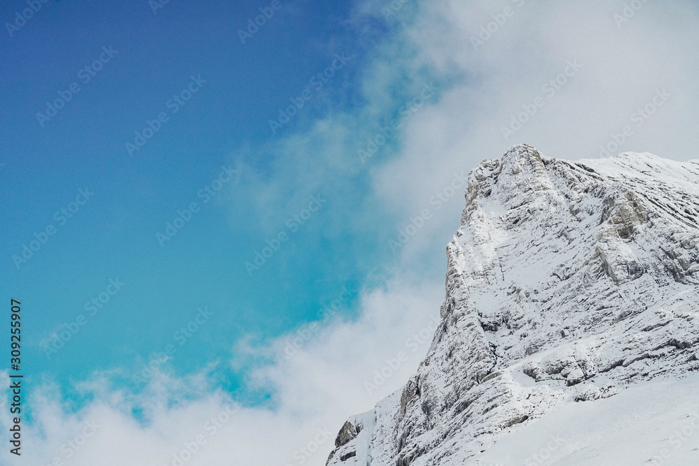 Snow White Glacier Mountains with Brilliant Blue Sky