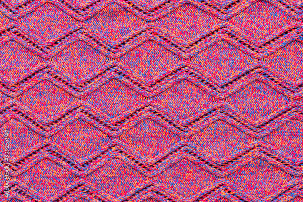 Knitted sweater texture. Pink melange rhombus pattern. Background. Copy space