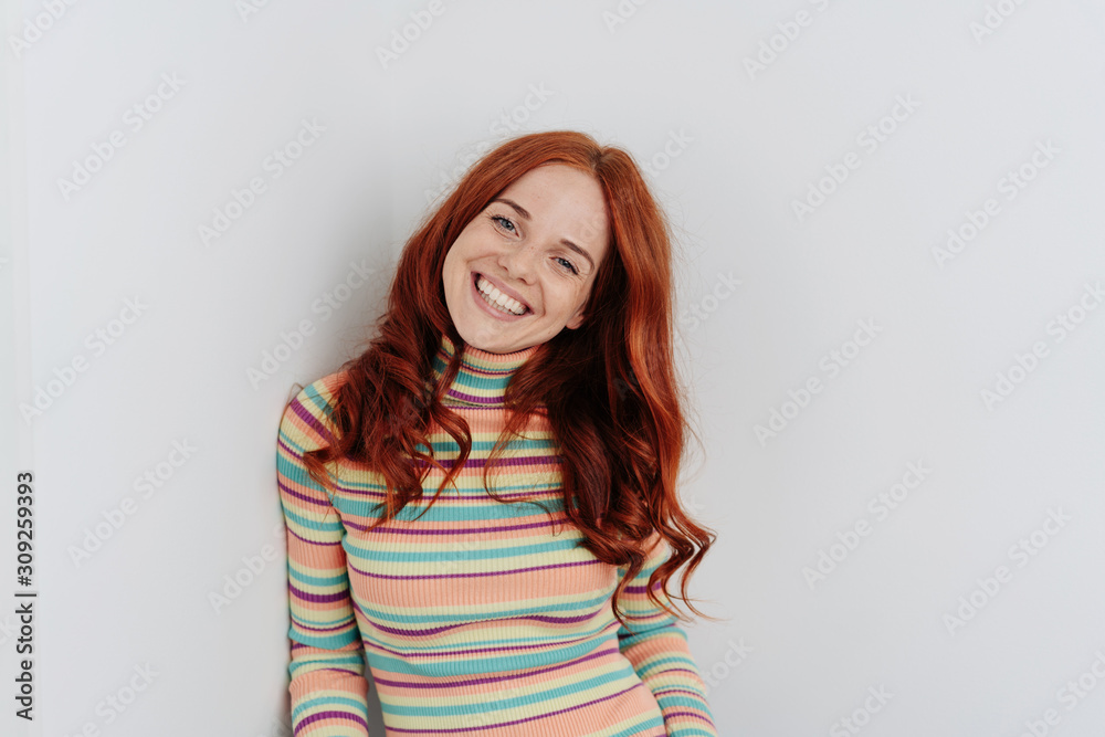Happy young redhead woman with a cute grin Happy young redhead woman with a cute grin