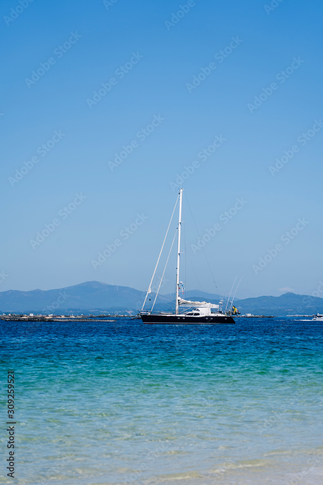 A sailboat near a beach